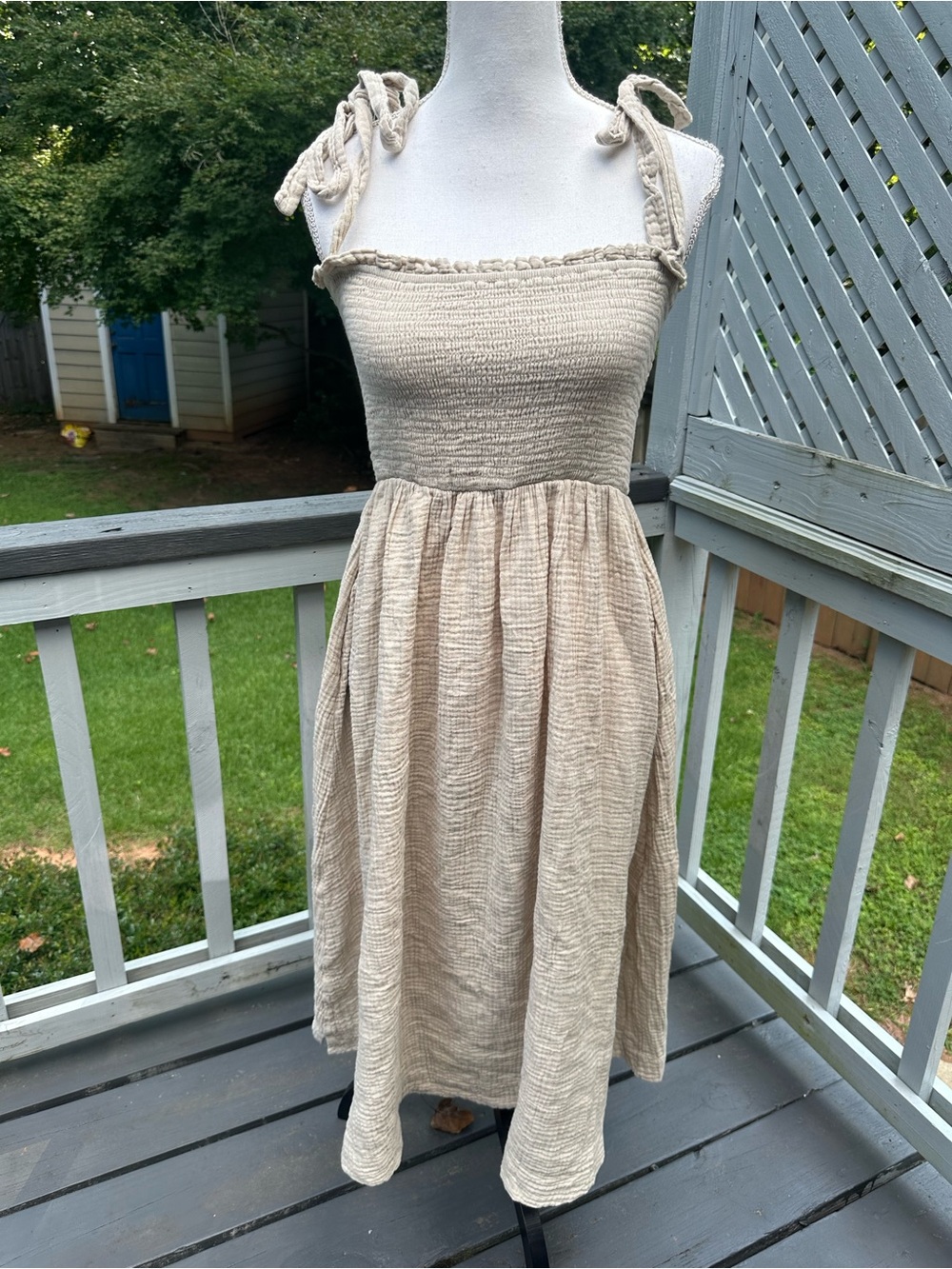 Carly Jean Los Angeles cream dress with adjustable tie straps and smocked bust